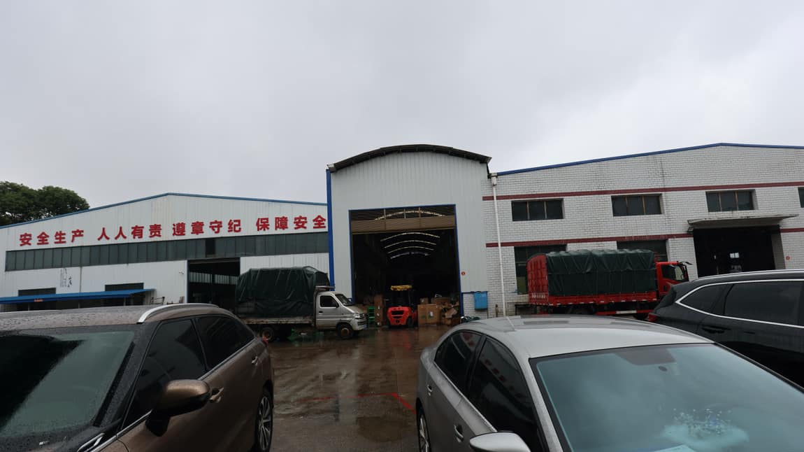 Trucks being loaded at the workshop gate before the run to the port